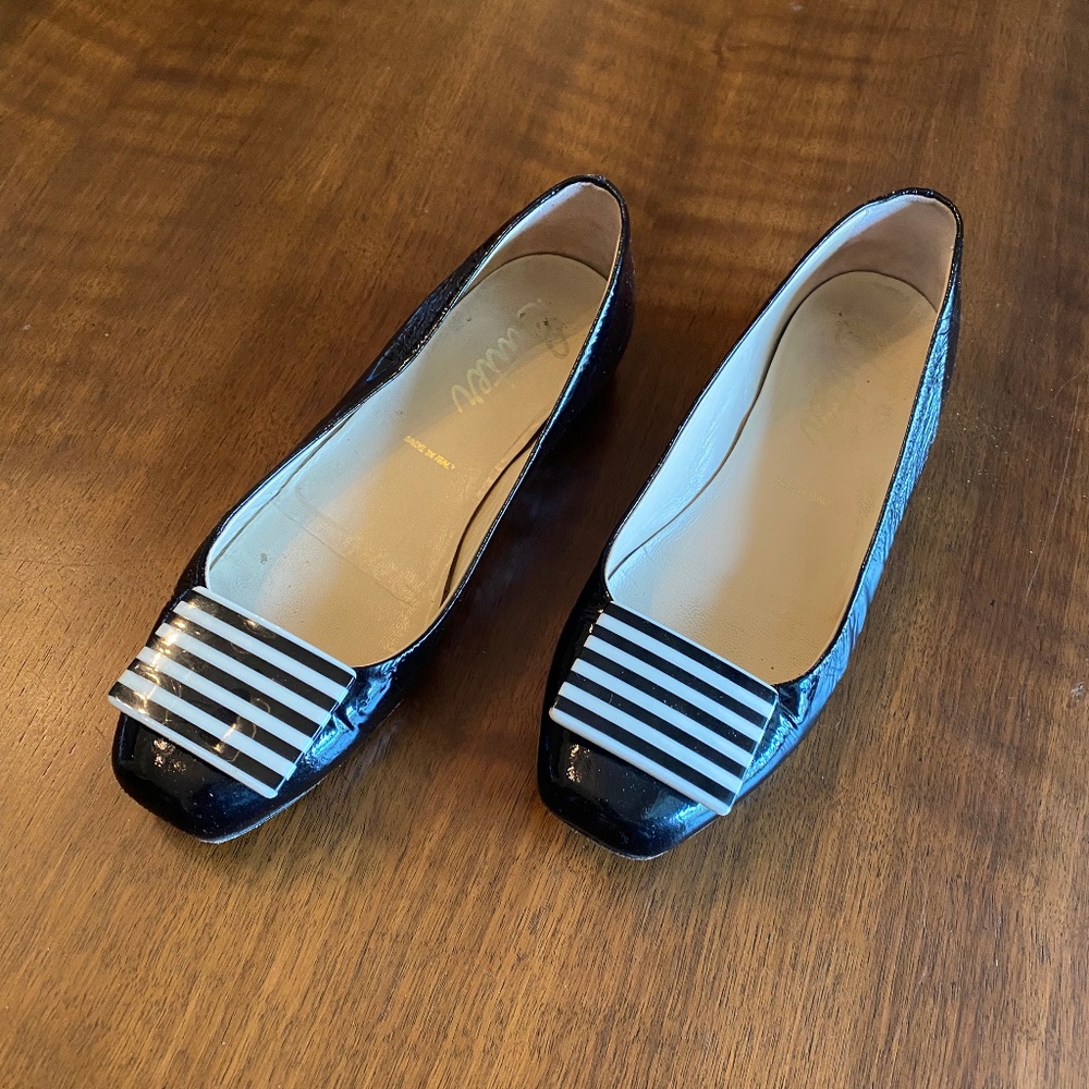 Ladies Butter black flats with black and white toe detail. Size 6.